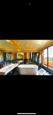 a large bathroom with two sinks and a large tub at Villa Marrakech in Oulad Akkou