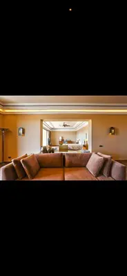 a living room with a large brown couch at Villa Marrakech in Oulad Akkou