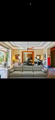 a living room with two couches and a table at Villa Marrakech in Oulad Akkou