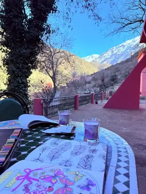 a table with two glasses on top of it at 3A Retreat Lodge in Ourika