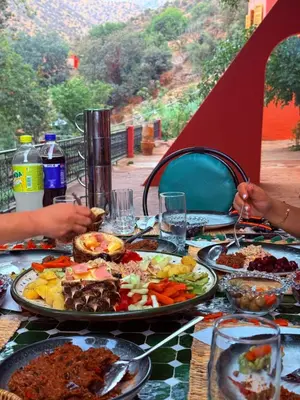 a table with a plate of food on it at 3A Retreat Lodge in Ourika