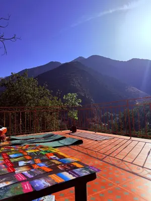 a deck with a view of a mountain at 3A Retreat Lodge in Ourika