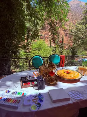 a table with a white table cloth with food on it at 3A Retreat Lodge in Ourika