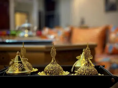 a group of gold bells sitting on a table at Spacious 140m Family Flat with air conditioner in Fès