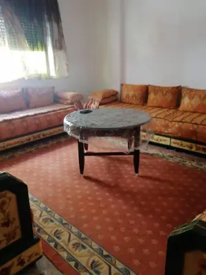 a living room with a couch and a coffee table at Entire home in Tangier, Morocco in Oulad Akkou