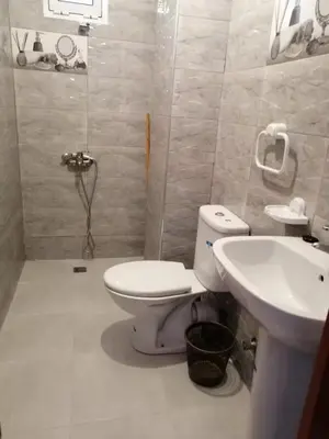 a bathroom with a toilet and a sink at Entire home in Tangier, Morocco in Oulad Akkou