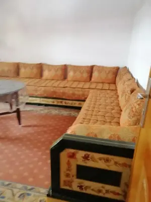 a living room with a couch and a table at Entire home in Tangier, Morocco in Oulad Akkou