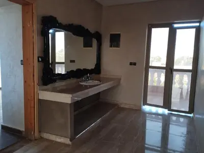 a bathroom with a sink and a mirror at Dreamy Stay in Ourika NOVA Pool Villa with Atlas Backdrop in Aguelmous