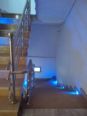 a set of stairs with blue lights on them at Dreamy Stay in Ourika NOVA Pool Villa with Atlas Backdrop in Aguelmous
