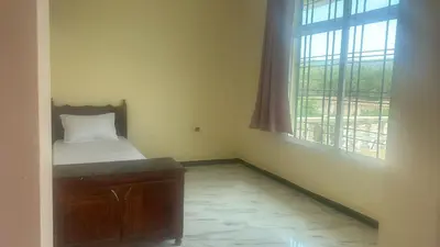a small room with a bed and a window at Auberge nadia in Sefrou