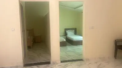 a view of a room with a bed and a mirror at Auberge nadia in Sefrou