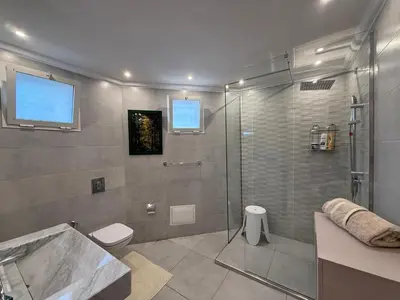 a bathroom with a shower and a toilet and a sink at Maison De Maitre in Fès