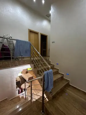 a room with stairs with a blue towel on the railing at villa imouzzer in Imouzzer Kandar