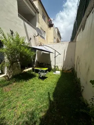 a backyard with a picnic table in the grass at villa imouzzer in Imouzzer Kandar