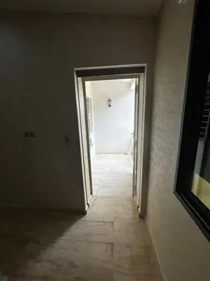 an empty hallway with a door leading into a room at villa imouzzer in Imouzzer Kandar
