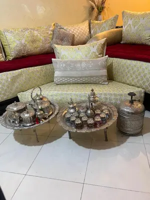 a couch with two tables with tea pots on it at Appartement cosy à Fès in Fès