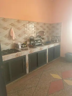 a kitchen with a sink and a counter top at Tinzouline in Tinzouline