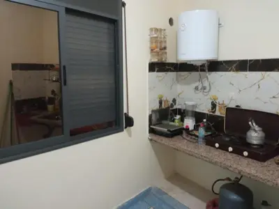 a kitchen with a counter and a window in a room at House of Dreams in Khenifra