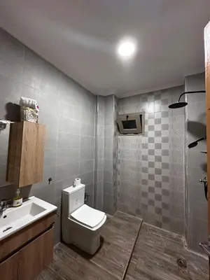 a bathroom with a toilet and a sink at Villa avec piscine in Meknès