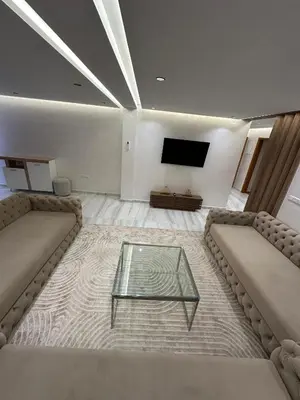 a living room with two couches and a tv at dar diyafa in Beni Mellal