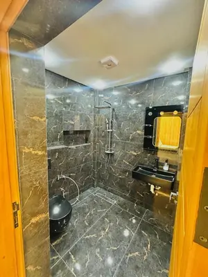 a bathroom with a sink and a shower at dar diyafa in Beni Mellal