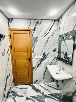 a bathroom with a sink and a mirror at dar diyafa in Beni Mellal