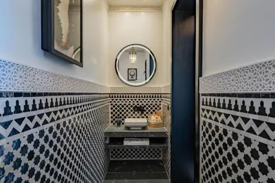 a bathroom with a sink and a mirror at Villa Chocolat Deluxe in Marrakech