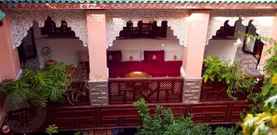 a room with some plants in a building at Riad Toyour- Riad of birds in Fès