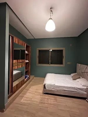 a bedroom with a bed and a window in it at Villa élégante in Meknès