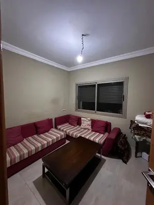 a living room with a couch and a table at Villa Lina in Meknès