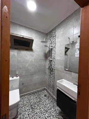 a bathroom with a sink and a toilet at Villa élégante in Aït Ali Ou Moussa