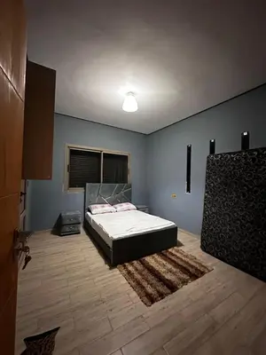 a bedroom with a bed in a room at Villa élégante in Aït Ali Ou Moussa