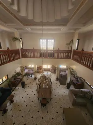 a large living room with couches and a table at La dolce villa in Sidi Bouzguia