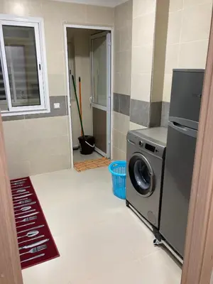 a kitchen with a washing machine in a room at Cozy apartment in Ifrane in Ifrane
