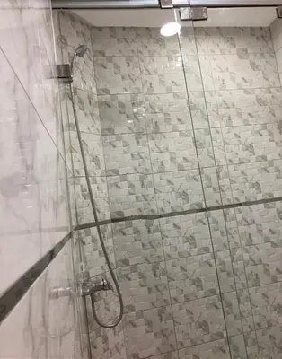 a shower with a glass door in a bathroom at Cozy apartment in Ifrane in Ifrane