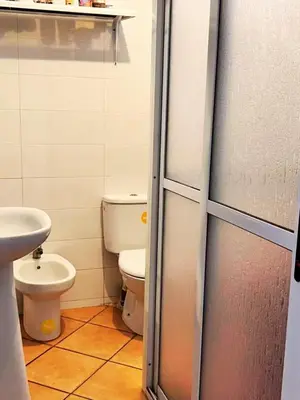 a bathroom with a toilet and a sink at Apartment in Ouedlaou in Oulad Akkou