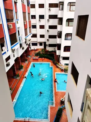an overhead view of a swimming pool in a building at Apartment in Ouedlaou in Oulad Akkou