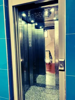 a glass door with a view of a hallway at Apartment in Ouedlaou in Oulad Akkou