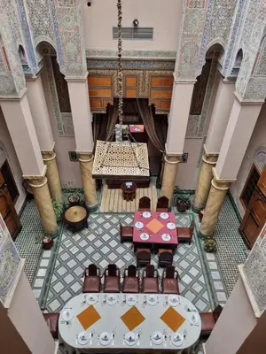 an overhead view of a lobby with a table and chairs at Riad Victoria in Fès