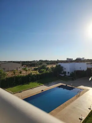 a view of a swimming pool from a balcony at Auberge rahha