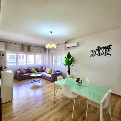 a living room with a couch and a table at Appartement centre ville avec Wifi 100Mo in Fès