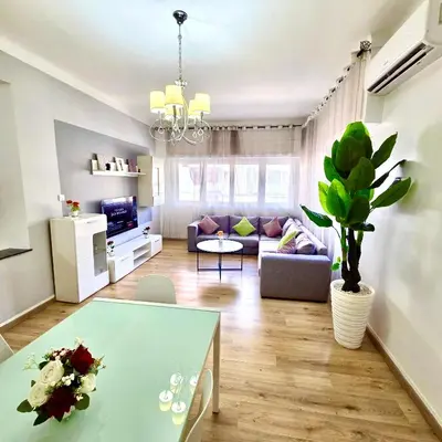 a living room with a couch and a table at Appartement centre ville avec Wifi 100Mo in Fès