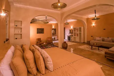 a large bedroom with a large bed in a room at Riad Serai Merzouga in Merzouga