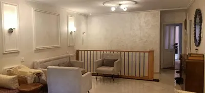 a living room with two chairs and a couch at Duplex Rahma in Fès