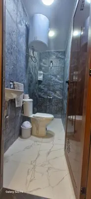 a bathroom with a toilet and a sink and a shower at Studio Gate Fes in Fès