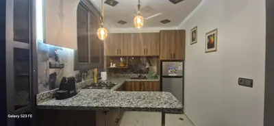 a kitchen with a counter top and a refrigerator at Studio Gate Fes in Fès