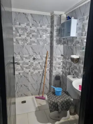 a bathroom with a shower with a toilet and a sink at Vip charme in Fès