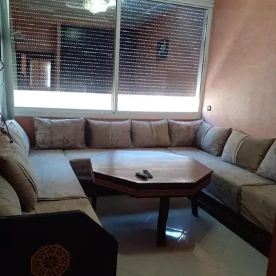a living room with a couch and a coffee table at Vip charme in Fès