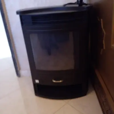 a black cabinet with a television in a room at Vip charme in Fès