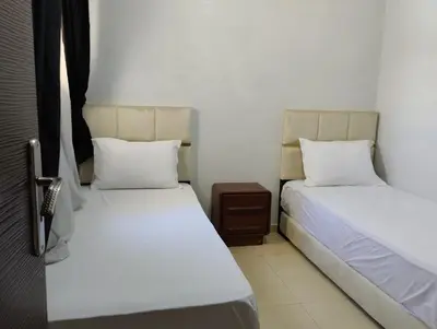 two beds sitting next to each other in a room at Dar Yasmine in Ifrane